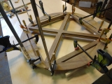 Teak table top in clamps